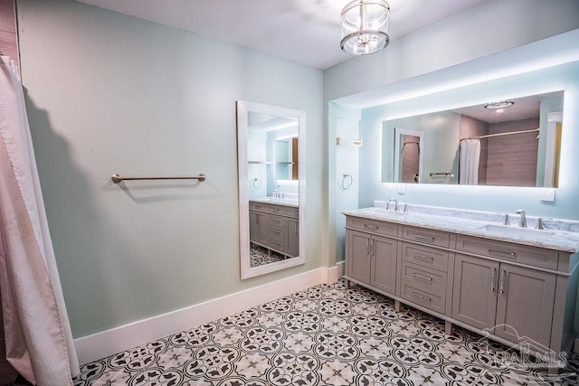 bathroom featuring a shower with curtain and vanity