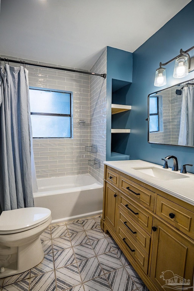 full bathroom with toilet, shower / bath combo, vanity, and a healthy amount of sunlight