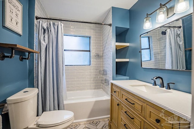 full bathroom featuring shower / bath combo with shower curtain, vanity, and toilet