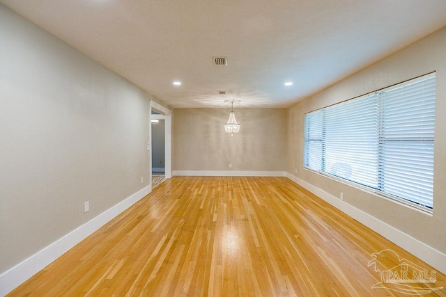 empty room featuring wood-type flooring