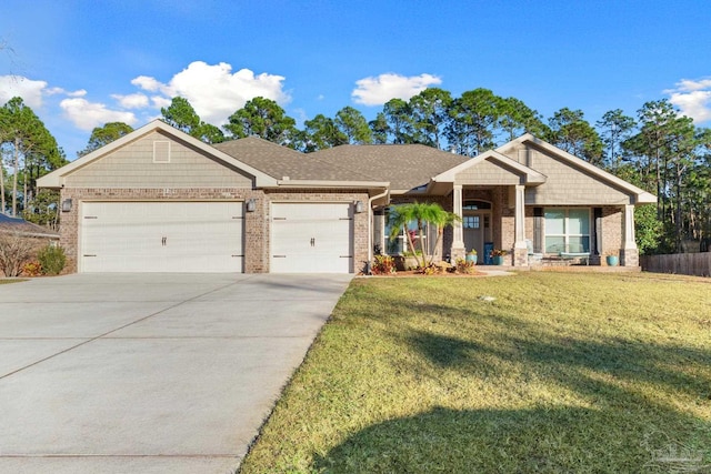 6743 Desoto St, Navarre, FL 32566 - craftsman inspired home featuring brick siding, an attached garage, concrete driveway, and a front yard