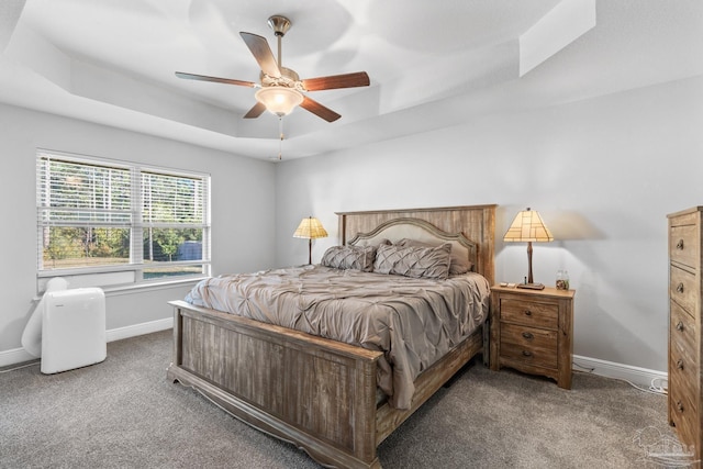 6743 Desoto St, Navarre, FL 32566 - bedroom with carpet flooring, a raised ceiling, baseboards, and ceiling fan
