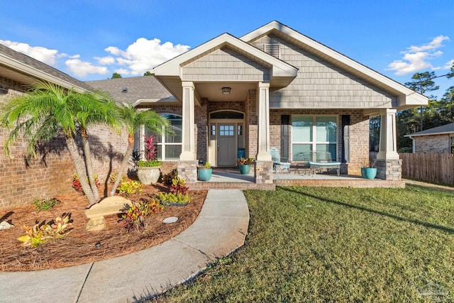 6743 Desoto St, Navarre, FL 32566 - view of front facade with covered porch and brick siding