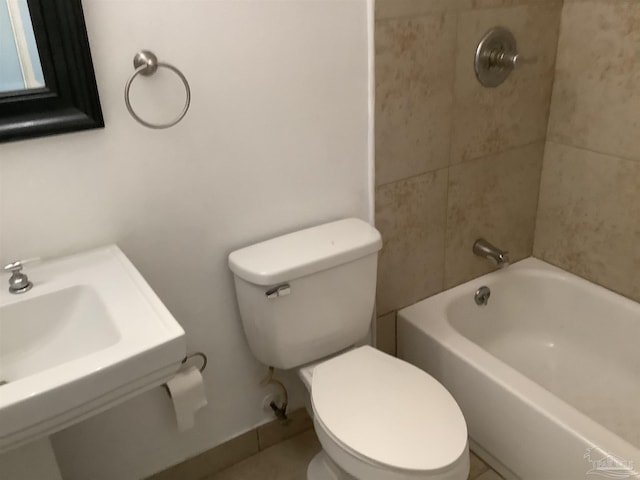 bathroom featuring a sink, toilet, and shower / bathtub combination