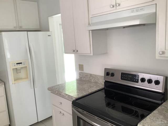 kitchen with under cabinet range hood, light countertops, stainless steel electric range oven, and white fridge with ice dispenser