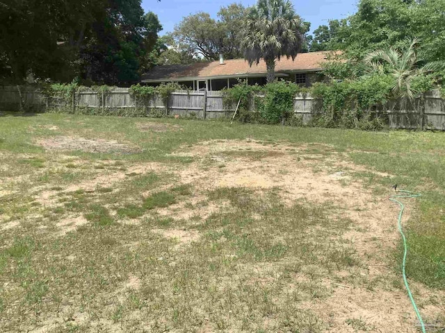 view of yard featuring fence