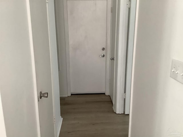 corridor with wood finished floors