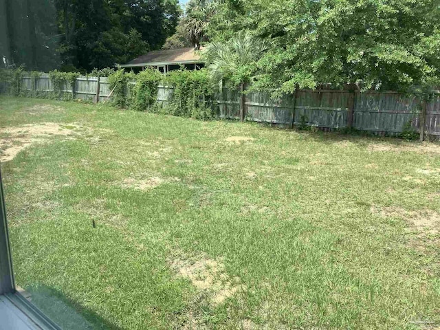 view of yard with a fenced backyard