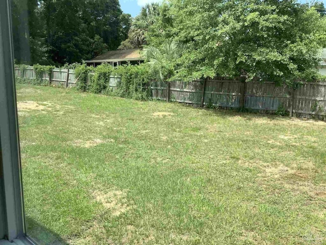 view of yard featuring a fenced backyard