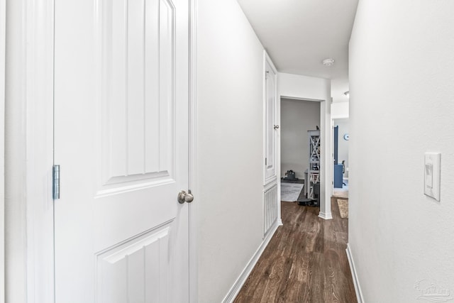 corridor featuring dark hardwood / wood-style floors