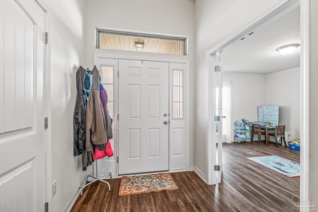 entryway with hardwood / wood-style flooring