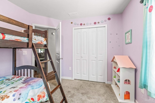 carpeted bedroom featuring a closet