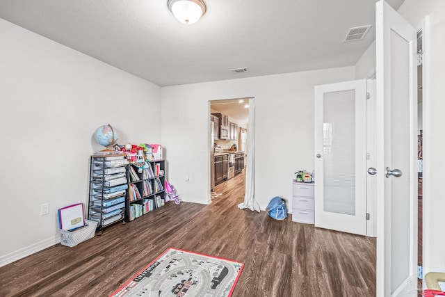 interior space with dark hardwood / wood-style floors