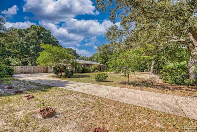 view of front of property with fence and a front yard