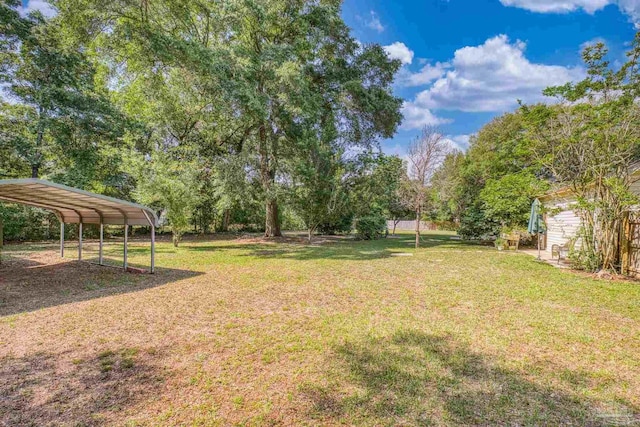 view of yard with a detached carport