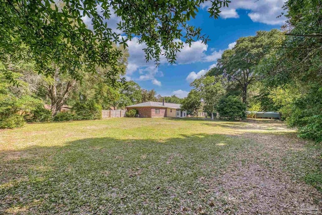 view of yard featuring fence