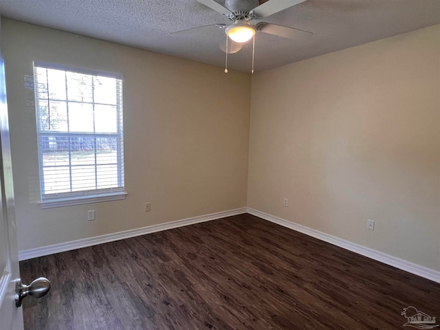 unfurnished room featuring a textured ceiling, ceiling fan, and dark hardwood / wood-style floors