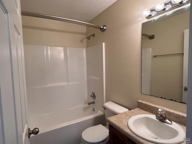 full bathroom with shower / bathtub combination, vanity, toilet, and a textured ceiling