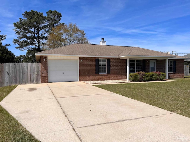 single story home with a garage and a front lawn