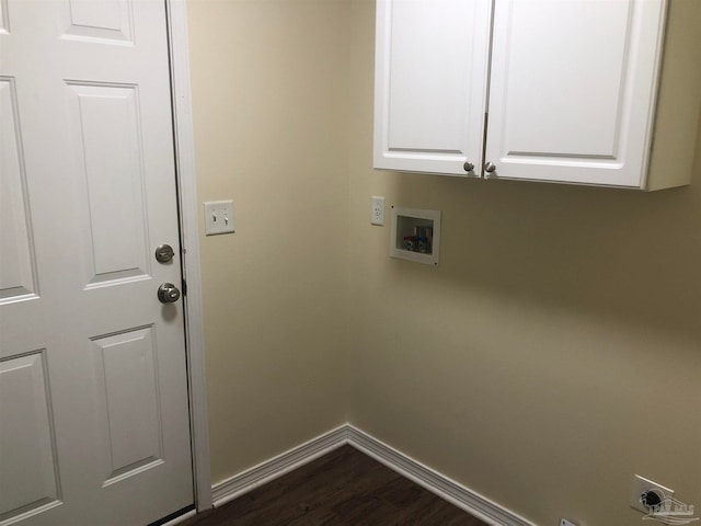 laundry room with dark wood-type flooring, hookup for a washing machine, cabinets, and hookup for an electric dryer