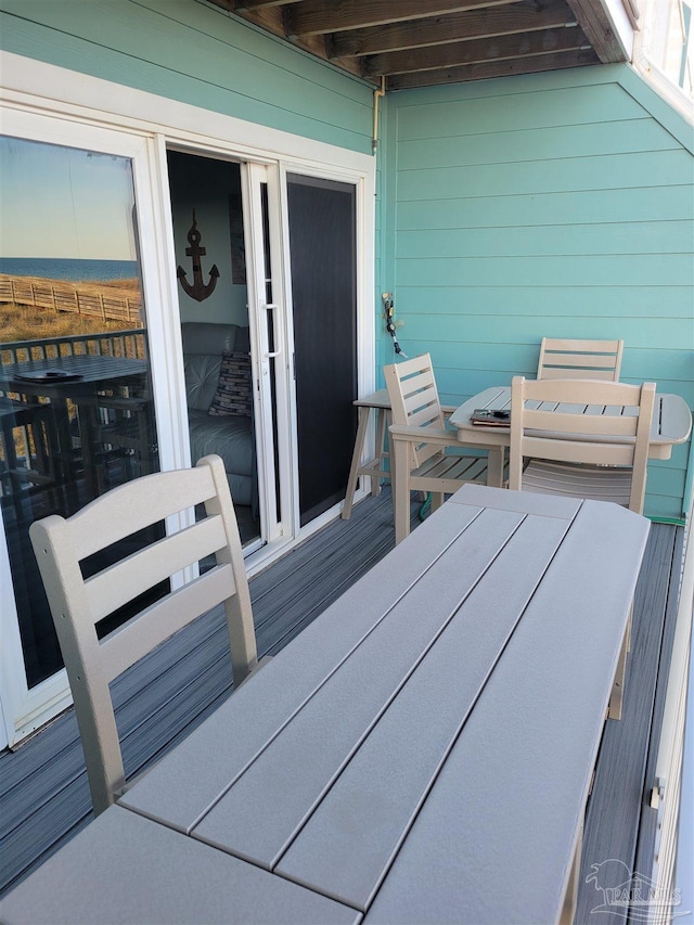 deck with outdoor dining area