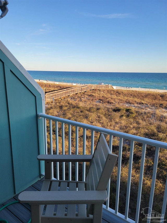 balcony with a beach view and a water view