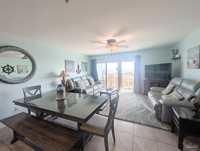 dining space with light tile patterned floors and ceiling fan