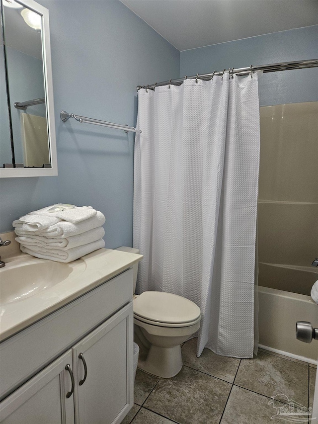 full bathroom with toilet, tile patterned flooring, vanity, and shower / tub combo with curtain