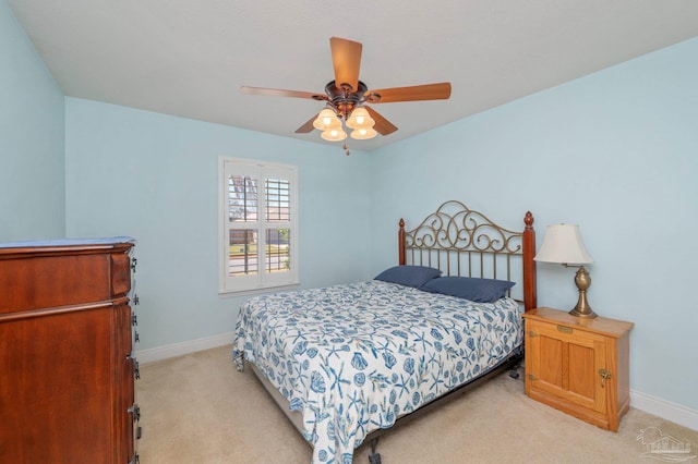 bedroom with baseboards, ceiling fan, and light colored carpet