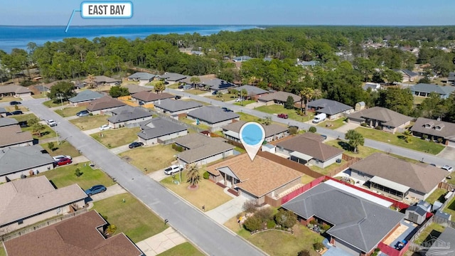 bird's eye view featuring a water view and a residential view