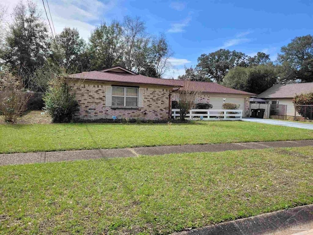 view of front of property featuring a garage and a front lawn