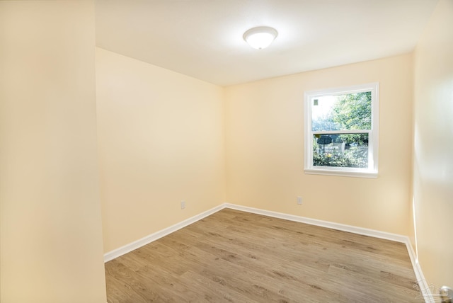 spare room featuring light wood-type flooring