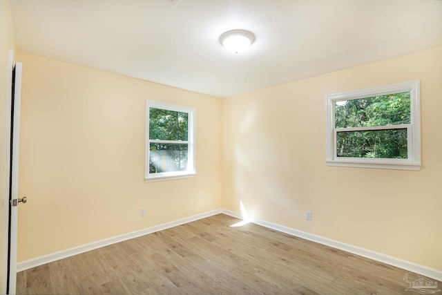 unfurnished room featuring light hardwood / wood-style flooring