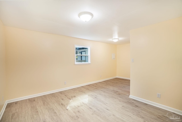 unfurnished room featuring light hardwood / wood-style floors