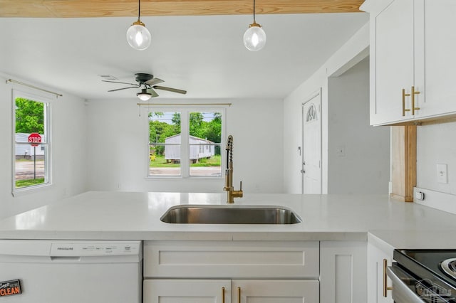 kitchen with ceiling fan, white dishwasher, light countertops, a sink, and white cabinetry