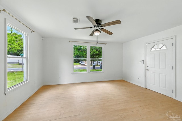foyer entrance featuring visible vents and a wealth of natural light