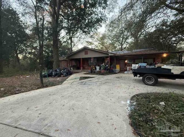 single story home featuring covered porch