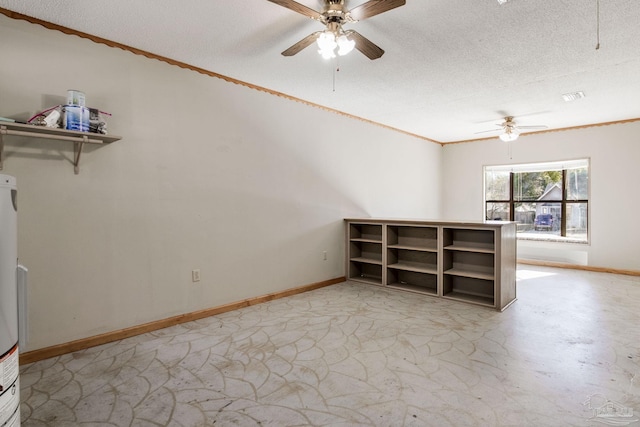 spare room featuring ceiling fan, ornamental molding, and a textured ceiling