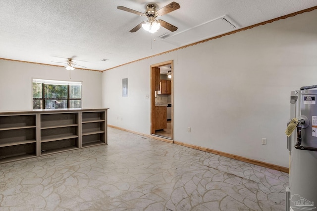 spare room featuring water heater, ceiling fan, and a textured ceiling