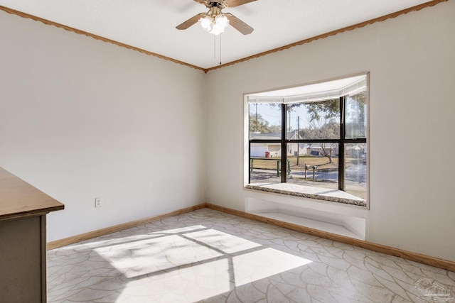 empty room featuring ornamental molding and ceiling fan