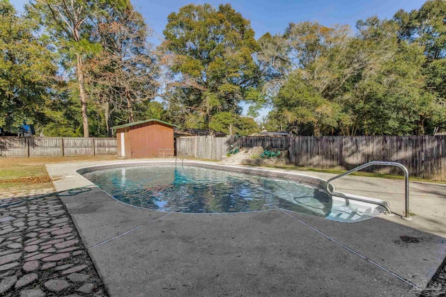 view of swimming pool featuring a shed