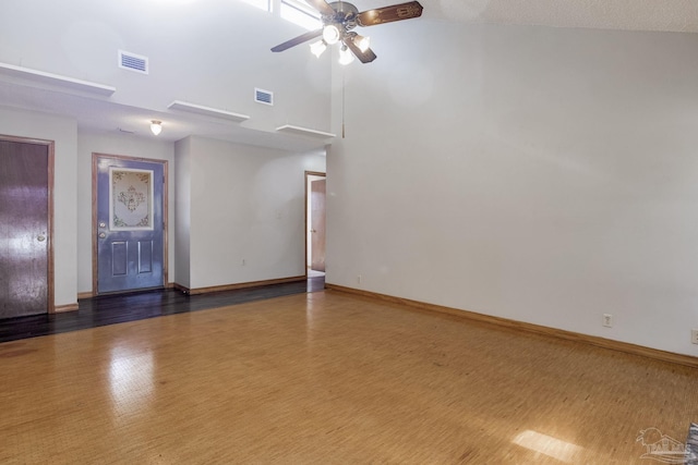 unfurnished room featuring ceiling fan and a textured ceiling