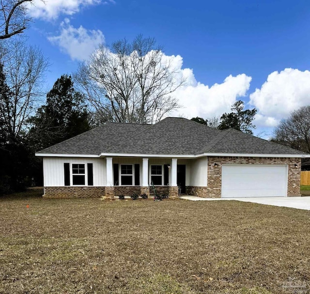 view of front of house with a garage, brick siding, concrete driveway, and a shingled roof