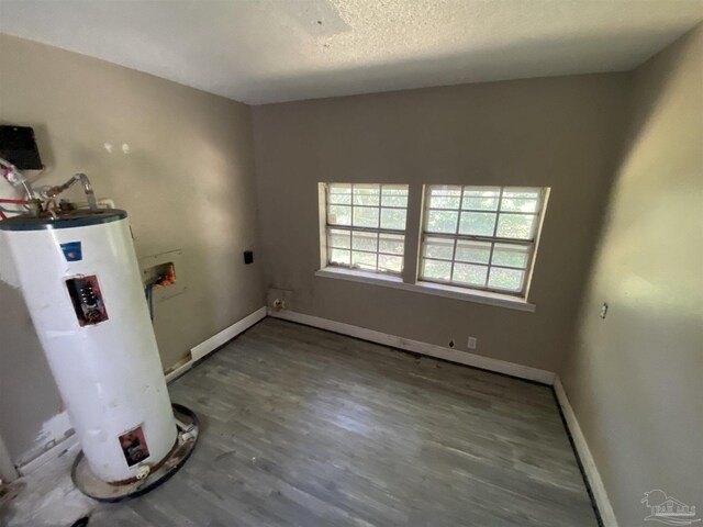 unfurnished dining area featuring a wealth of natural light and wood-type flooring