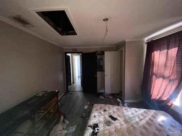 unfurnished bedroom featuring wood-type flooring and ornamental molding