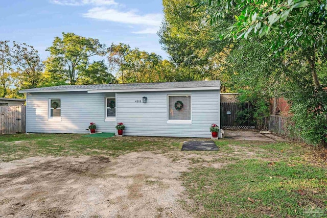 view of outbuilding featuring a yard