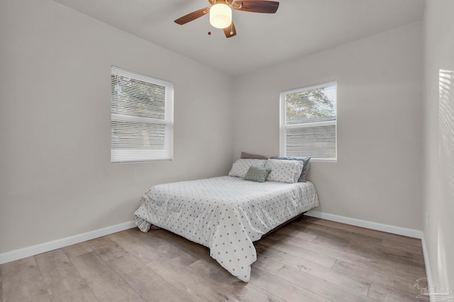 bedroom featuring ceiling fan and hardwood / wood-style flooring