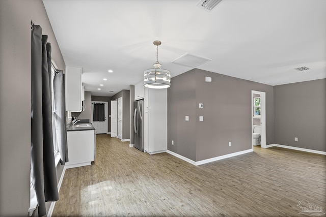 6609 Cedar St, Milton, FL 32570 - unfurnished living room with wood finished floors and recessed lighting