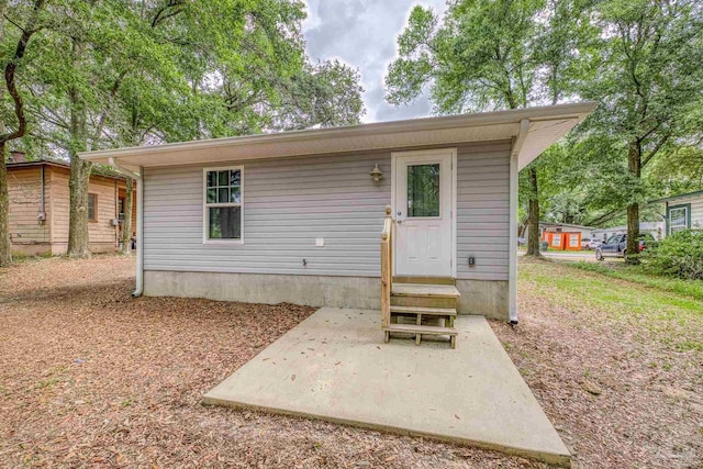 6609 Cedar St, Milton, FL 32570 - rear view of house with a patio and entry steps