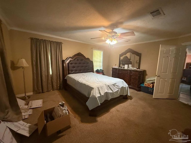 bedroom featuring crown molding, carpet flooring, and ceiling fan